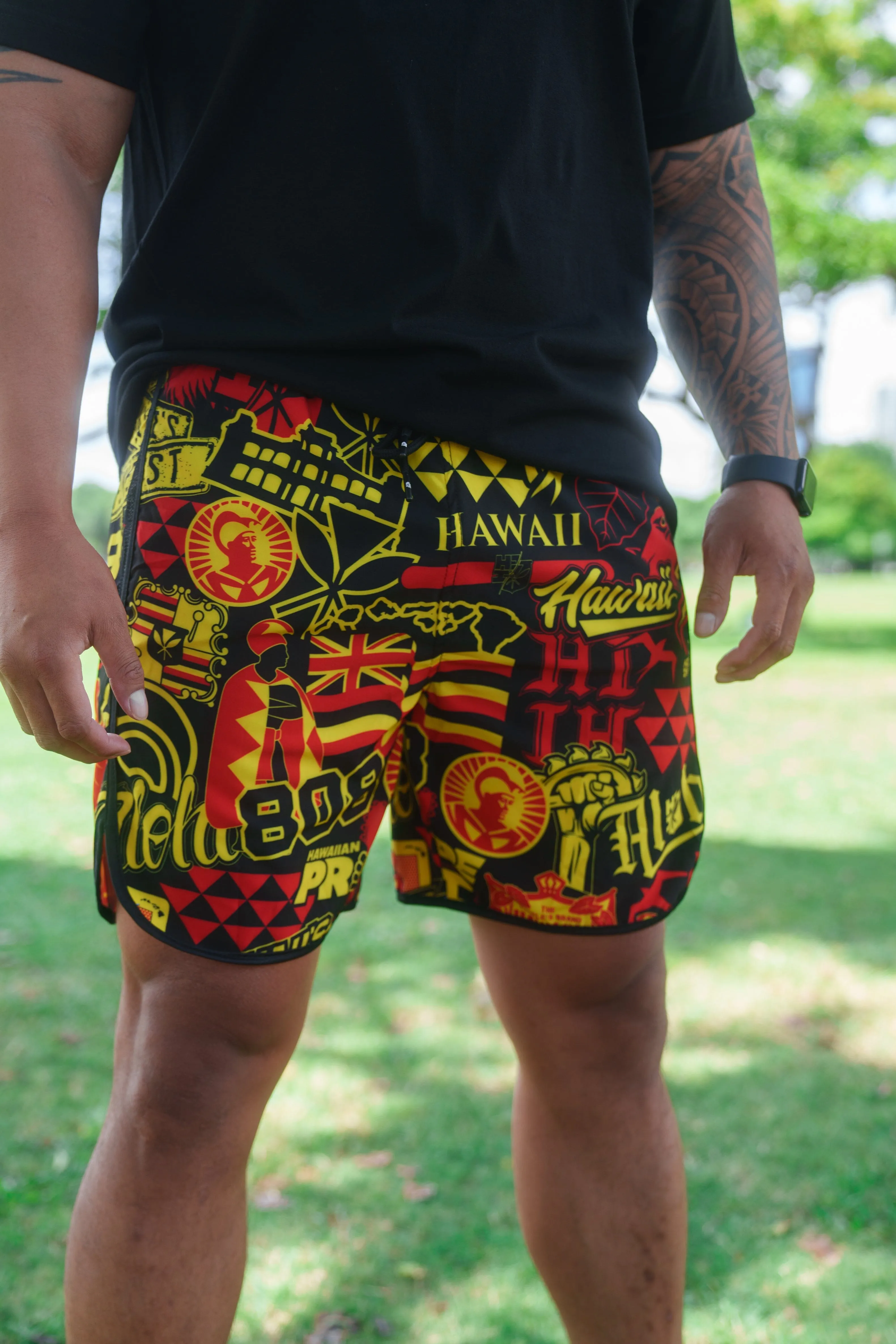 RED & YELLOW STICKERBOMB ALOHA FESTIVAL PERFORMANCE SHORTS